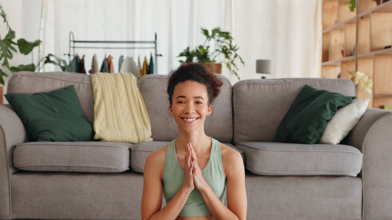 Face, yoga and prayer hands with woman in home