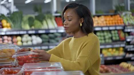 woman shopping for produce at a grocery store