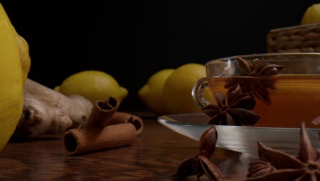 star anise fruits, sliced lemon, cinnamon bark and ginger - healthy tea