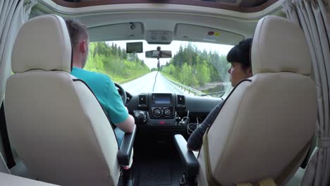 man driving on a road in the camper van rv