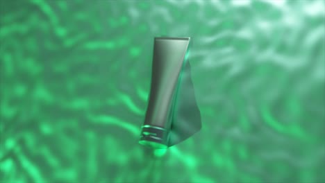 silver cosmetic tube on green background