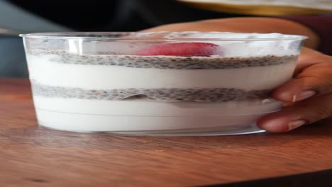 closeup of a chia pudding with strawberry on top