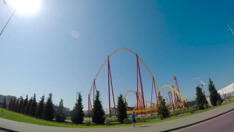 roller coaster at an amusement park on a sunny day