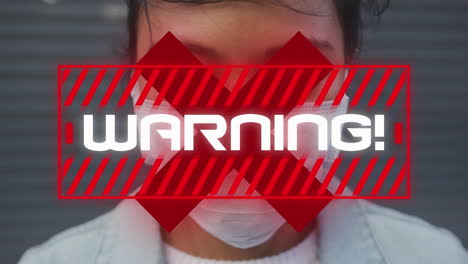 animation of text, warning, and x over woman wearing face mask in street