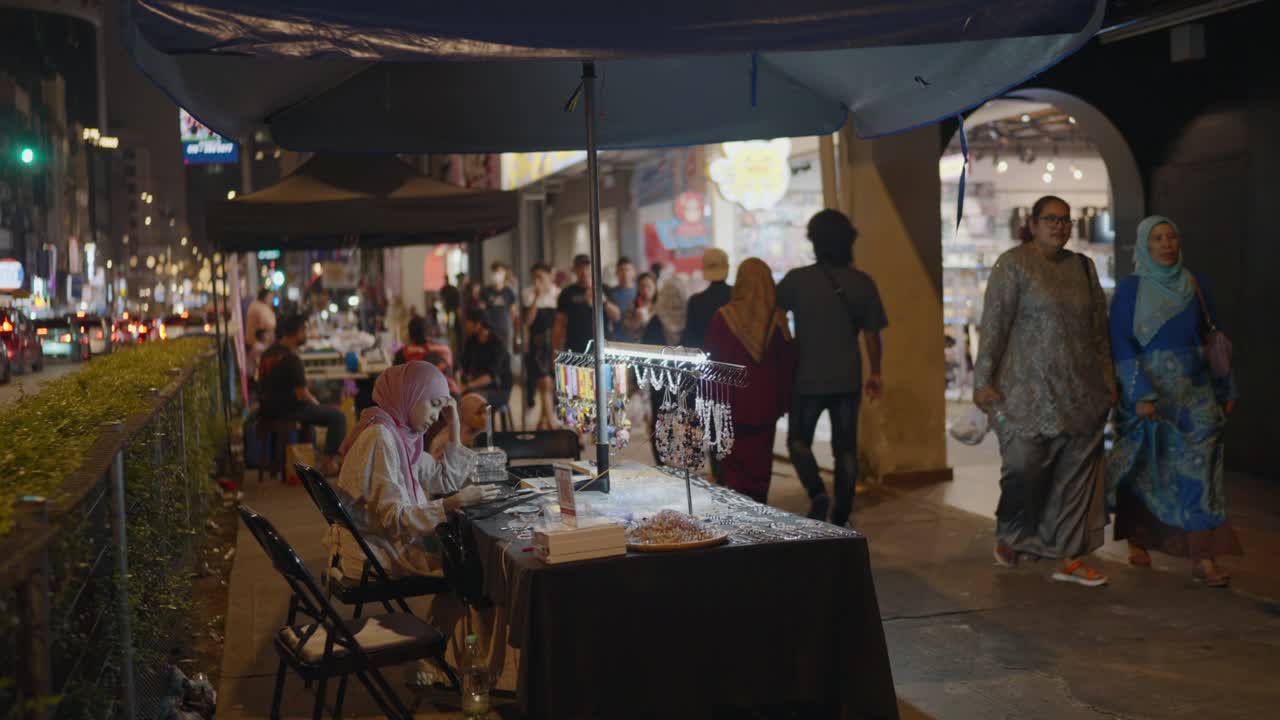 Night Market Street Vendor Selling Jewelry