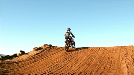 man riding a motor cross bike