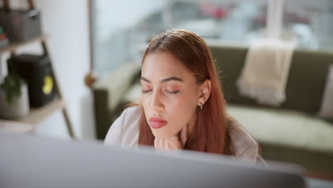 A young woman looking at a monitor