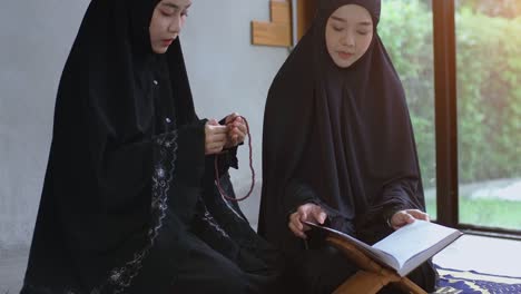 asian muslim woman praying and prostrating at home