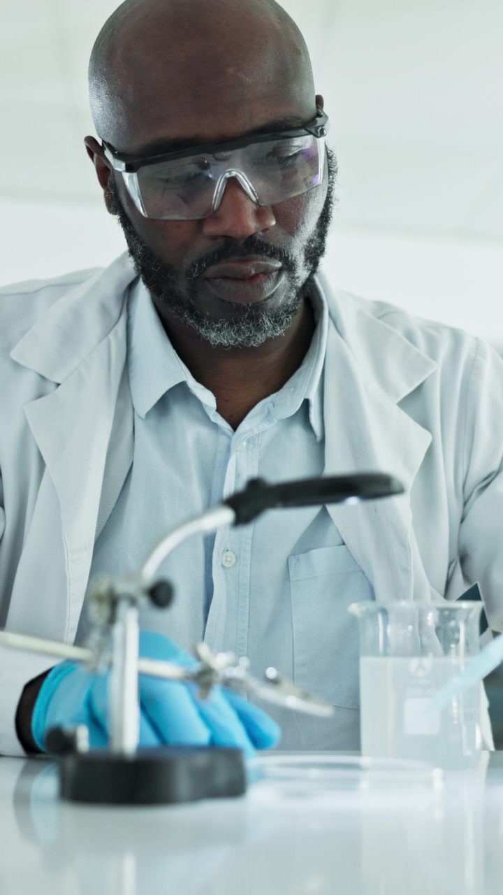 Scientist Conducting Laboratory Experiment with Pipette and Beaker