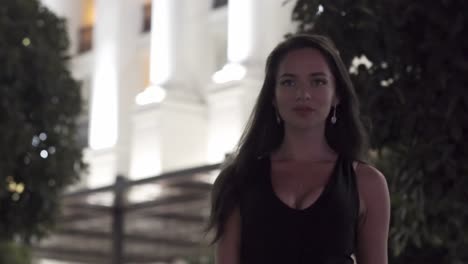 young woman in a city at night