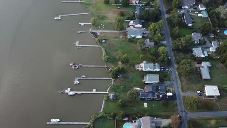 shoreline decks and houses on coast of kent island, chesapeake bay, maryland usa, birdseye pov aerial view