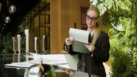 Blonde-receptionist-working-in-a-hotel