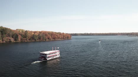 au sable river queen boat on the au sable river in michigan with drone video flying behind