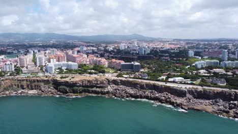 side panning shot of cascais rocky coastline, portugal