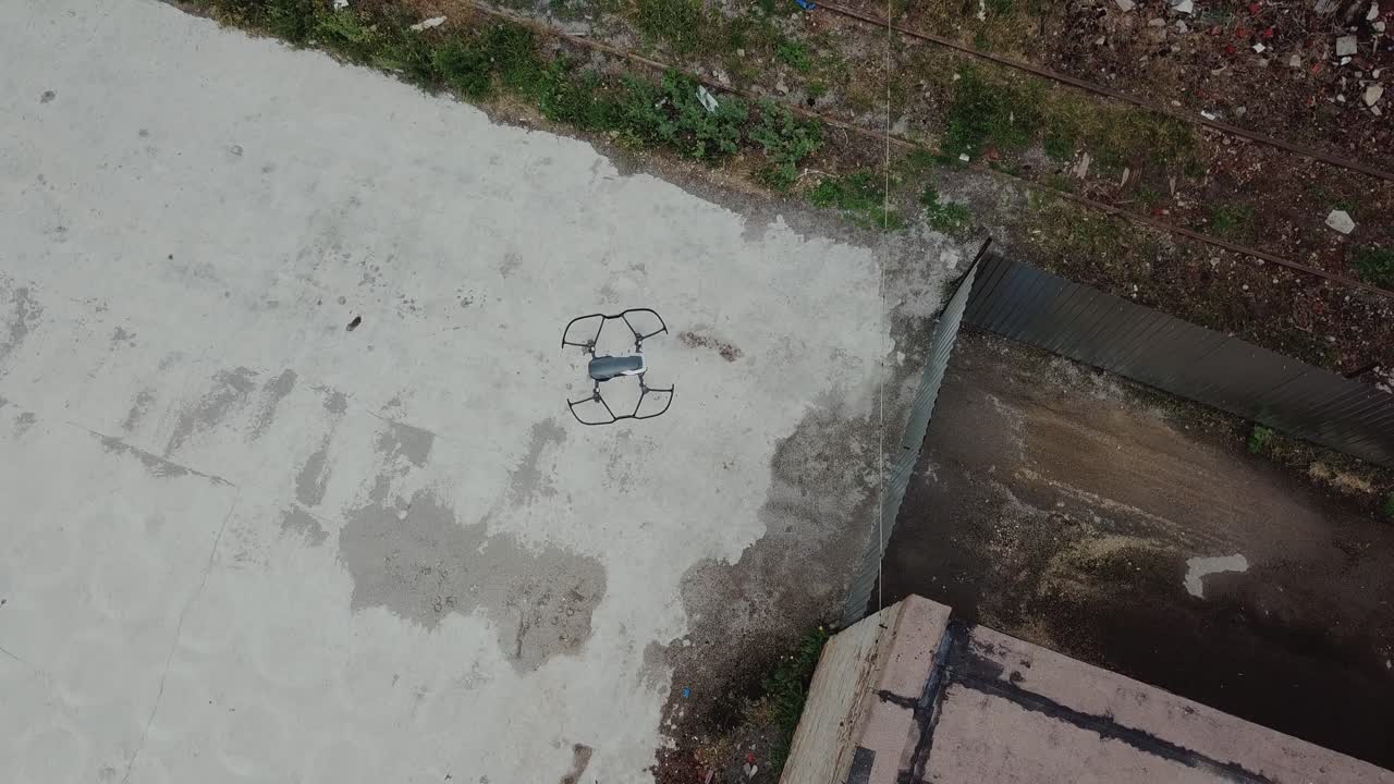 Flying over an abandoned factory with a drone. Industry in ruins.