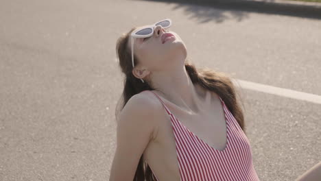 woman in a striped swimsuit on the street