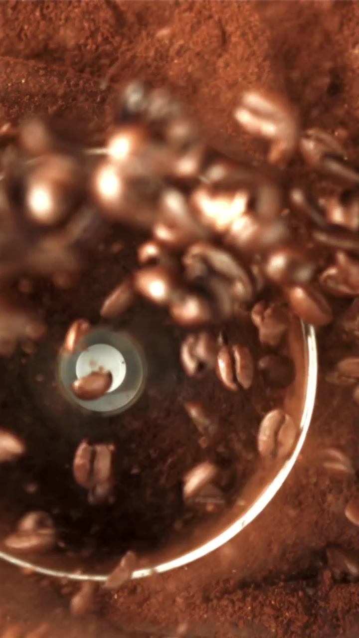 Coffee Beans Grinding into Fresh Powder in a Grinder