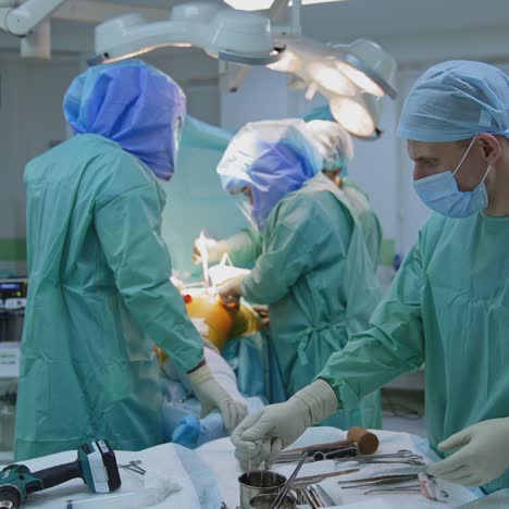 professional surgeon performing operation. cooperating team of doctors and surgeons processing surgical operation in operating room
