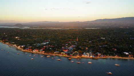 Aerial-view-of-Moalboal-Beach-at-the-sunset,-Cebu,-Philippines