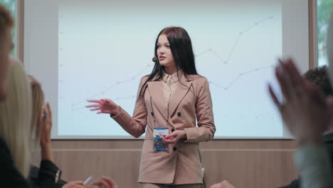 female specialist in field of marketing and finance is speaking in business meeting of board of directors