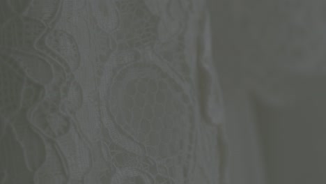 a close-up view of a wedding dress, illustrating its design elements in meticulous detail