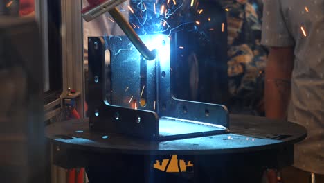 robot welding a metal bracket