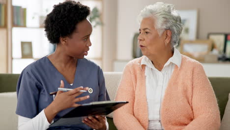 home healthcare visit: nurse consulting with senior woman