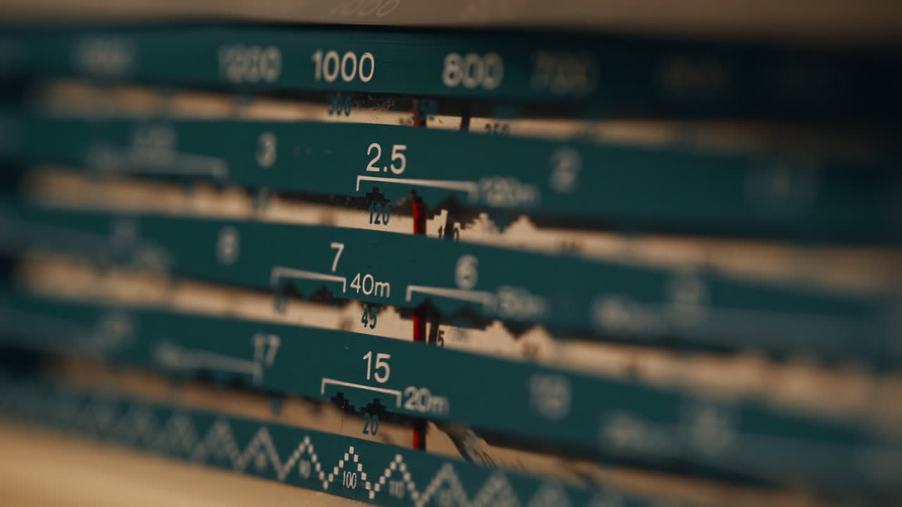 Old transistor radio tuning shortwave band closeup. Classic device catching