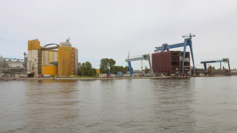 industrial port on banks of martwa wisla in gdansk, poland. wide shot