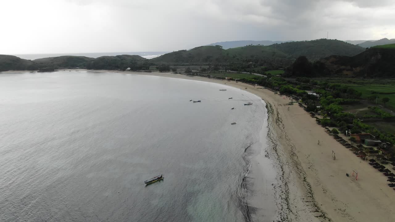 Tanjung Ana Beach empty and deserted on a windy and gloomy day in Indonesia