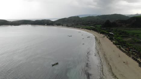 tanjung ana beach empty and deserted on a windy and gloomy day in indonesia