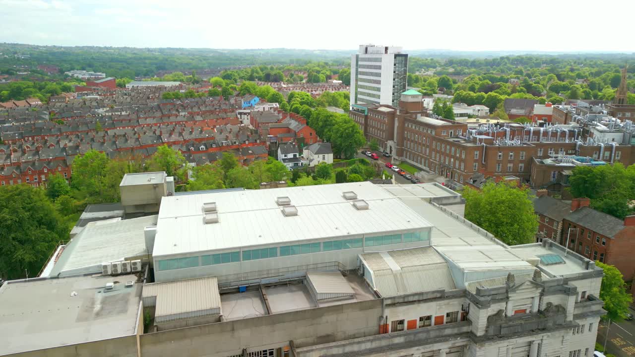 Advancing aerial video of Ulster Museum in Botanic Gardens in Belfast, Northern Ireland on a bright sunny day. Produced in 4K, 60 frames per second and with Rec709 color.