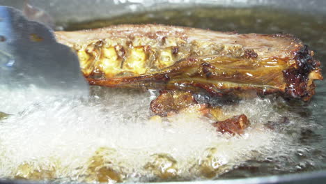 frying chicken in hot oil