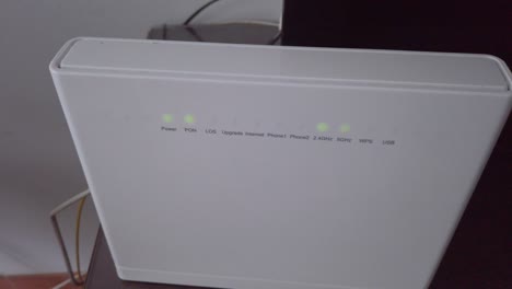 wifi router with red blinking light, high angle circling pan