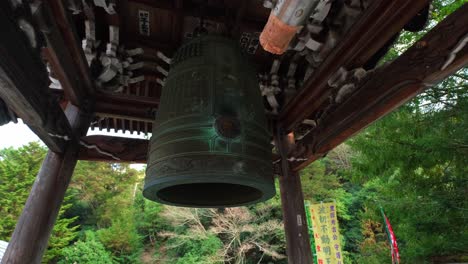 bonshō - large bell and suspended wooden beam on miyajima