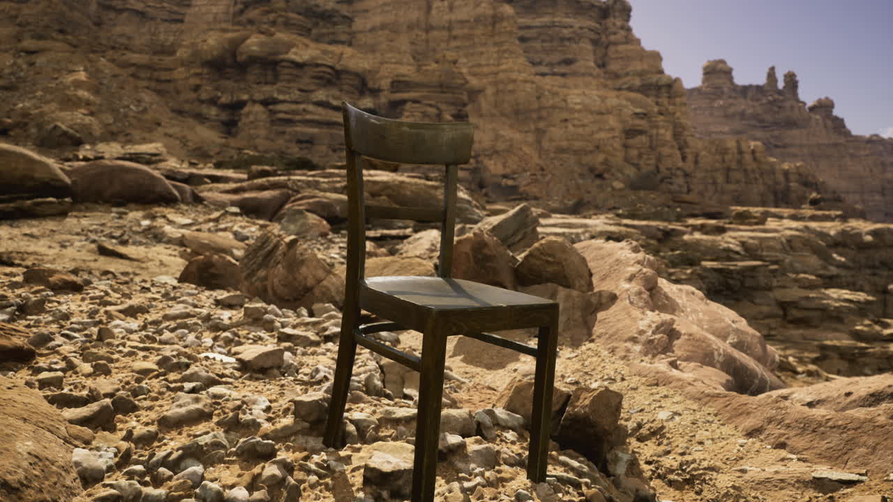 Lonely chair on rocky terrain in a remote desert landscape during midday