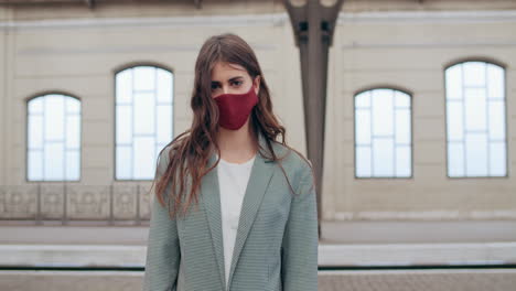 young woman wearing a face mask outdoors