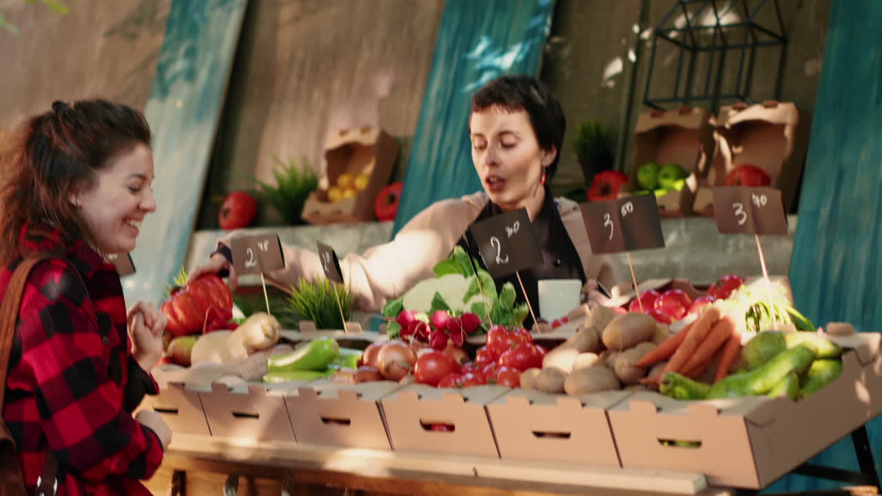 Customers buying fresh vegetables at a market