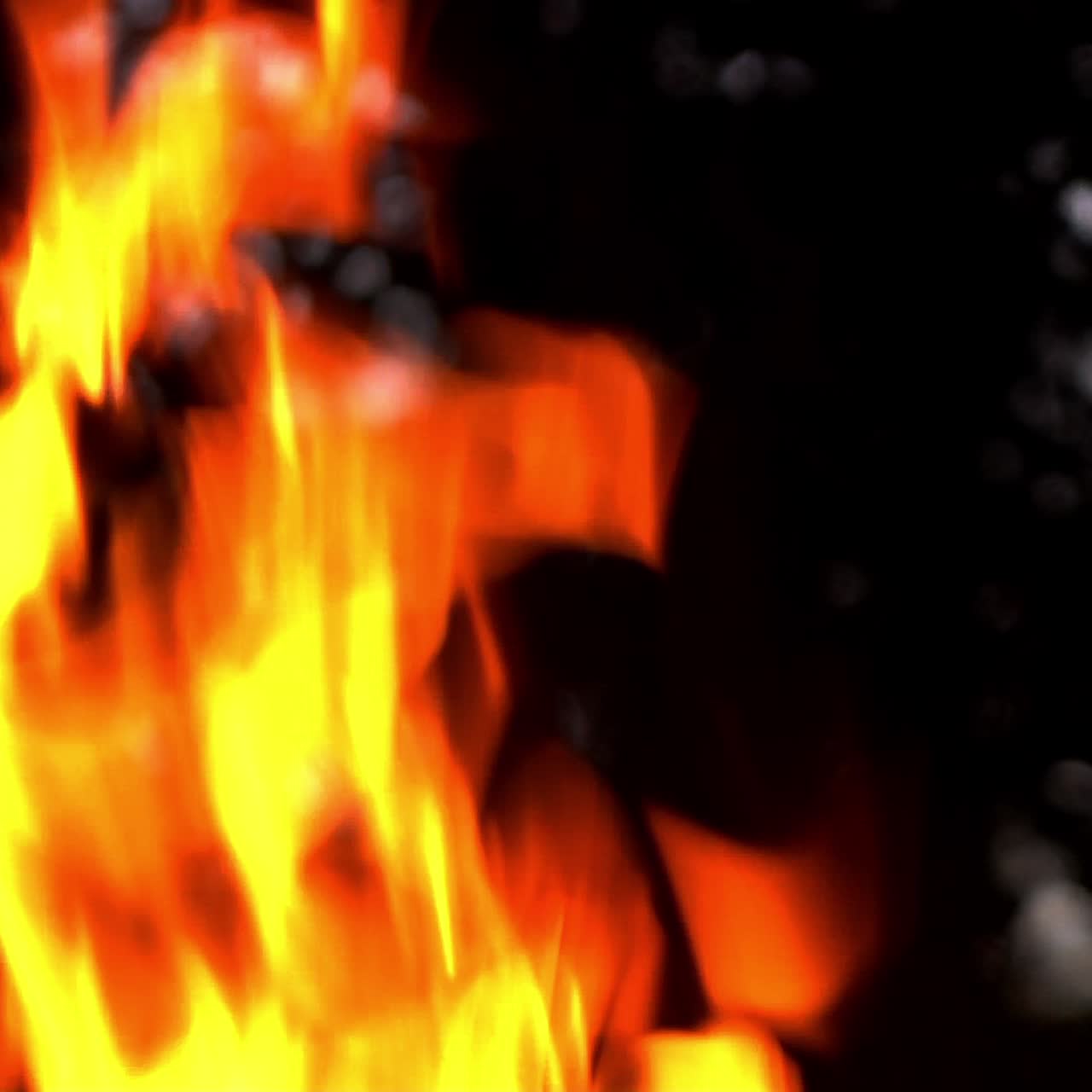 Fire flame on the black background. Fire in darkness. Slow motion