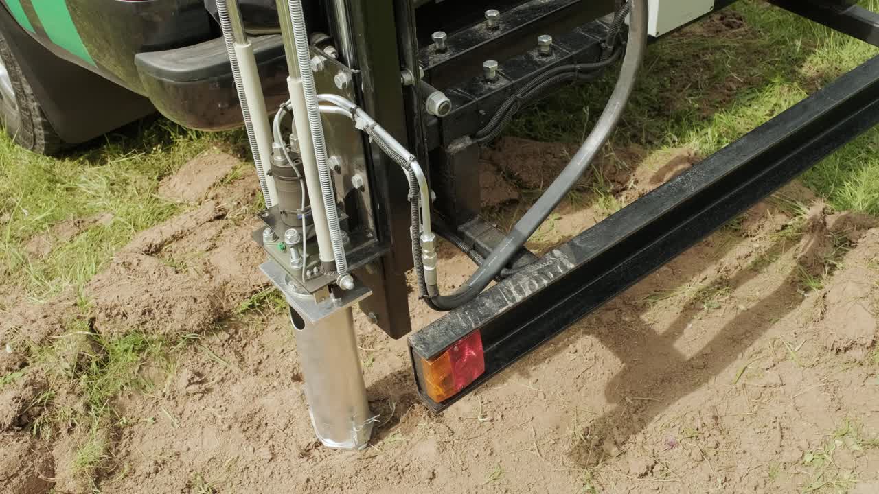 Soil examination of agronomy. Geotechnical investigation. Collecting black soil on the field for examination and analysis. Special equipment for pickup