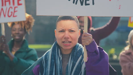 Group-Of-Protestors-With-Placards-Chanting-Slogans-On-Demonstration-March-Against-Climate-Change