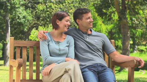 Young-couple-talking-and-laughing-together