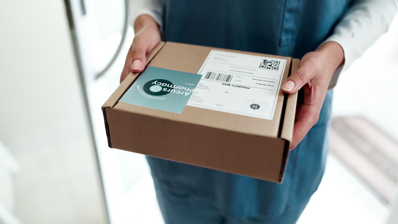 A person holding a delivery package from a pharmacy