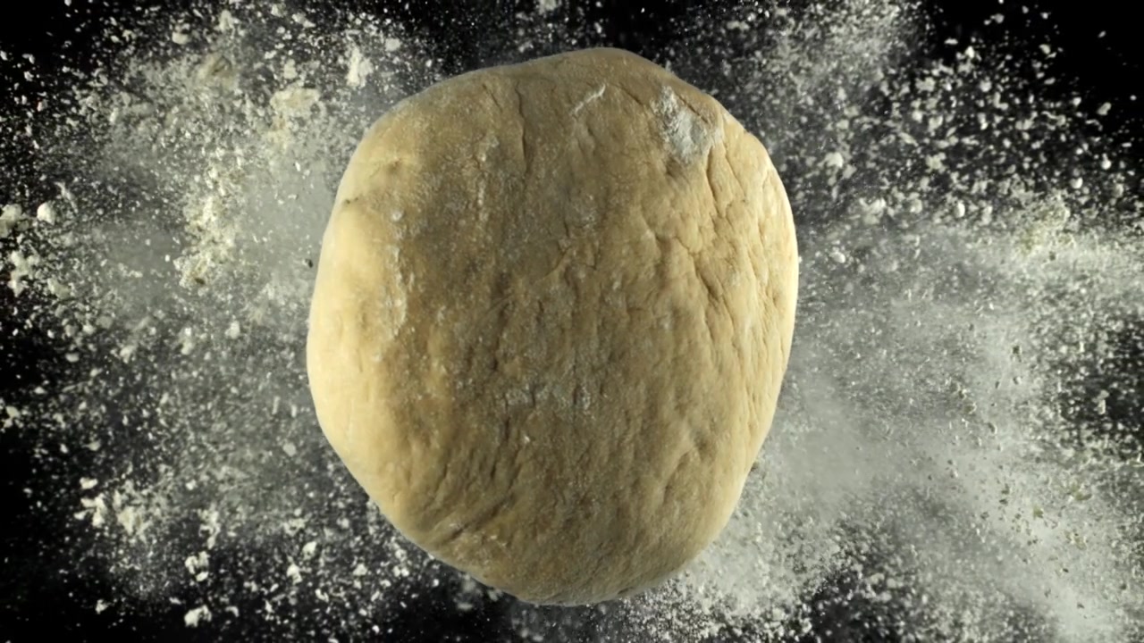 Slow Motion of Flour Falling on Fresh Dough