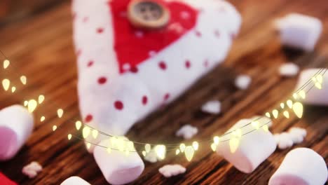 Animation-of-string-lights,-marshmallows-and-xmas-decorations