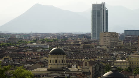 majestic shot over turin italy skyline with alps in background