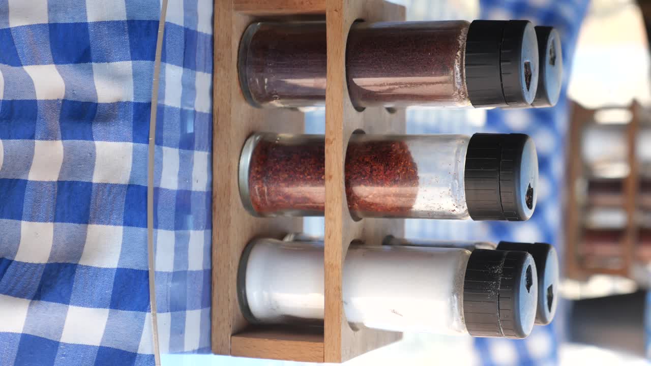 Spice Rack on Checkered Tablecloth