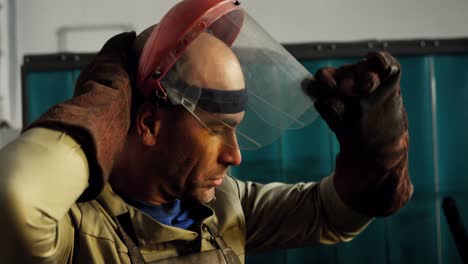 male welder wearing protective helmet