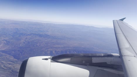 view of atlas and the mountains of morocco from the window of an airplane