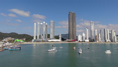 luxury yachts anchored along balneario camboriu coast, backed by stunning modern skyscrapers